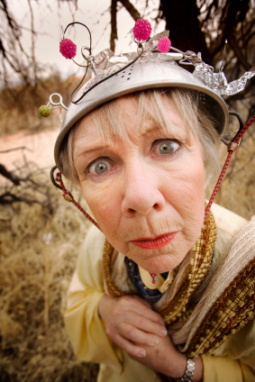 Crazy woman wearing a metal colander for a helmet